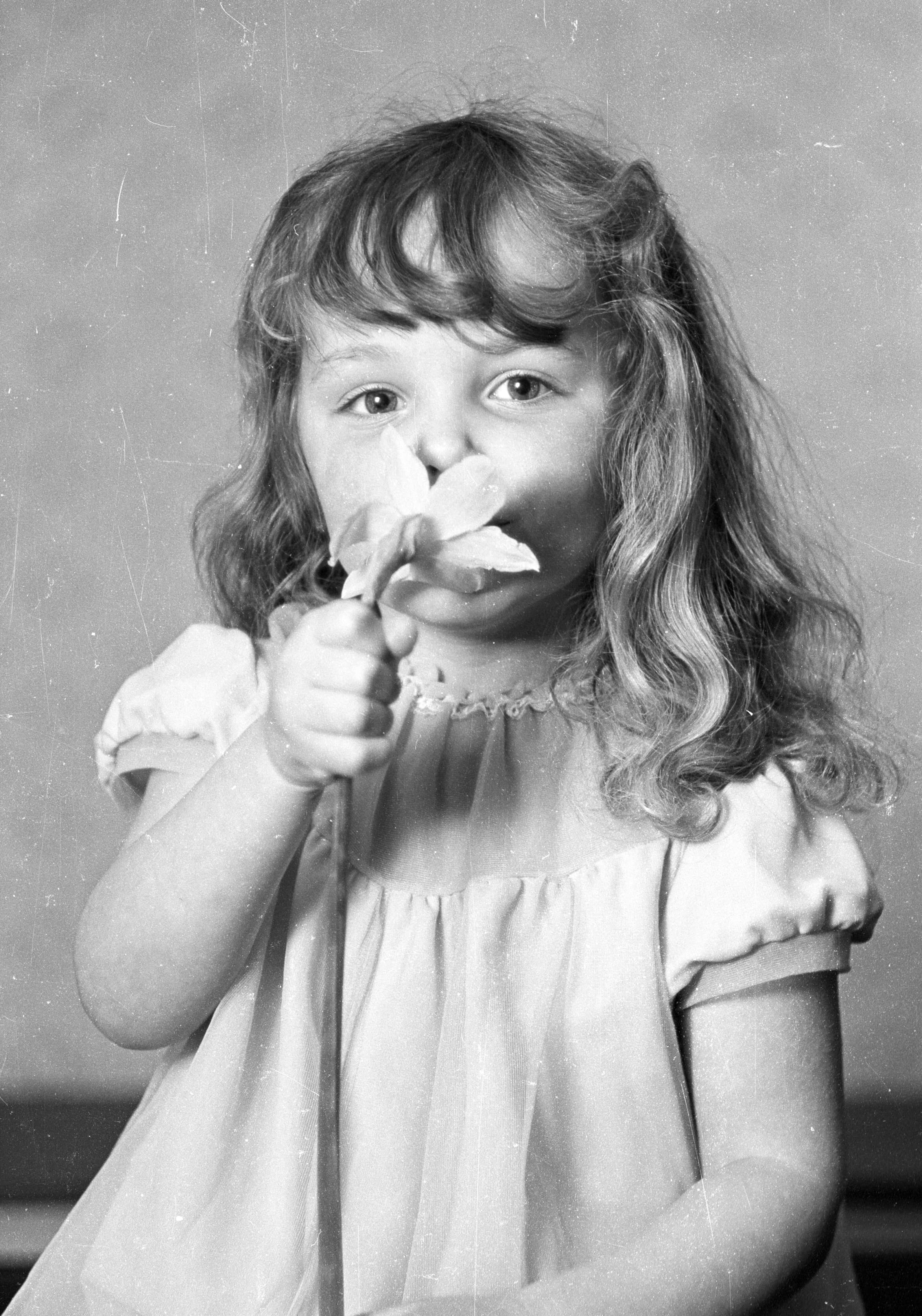 Jaki as a toddler with a flower